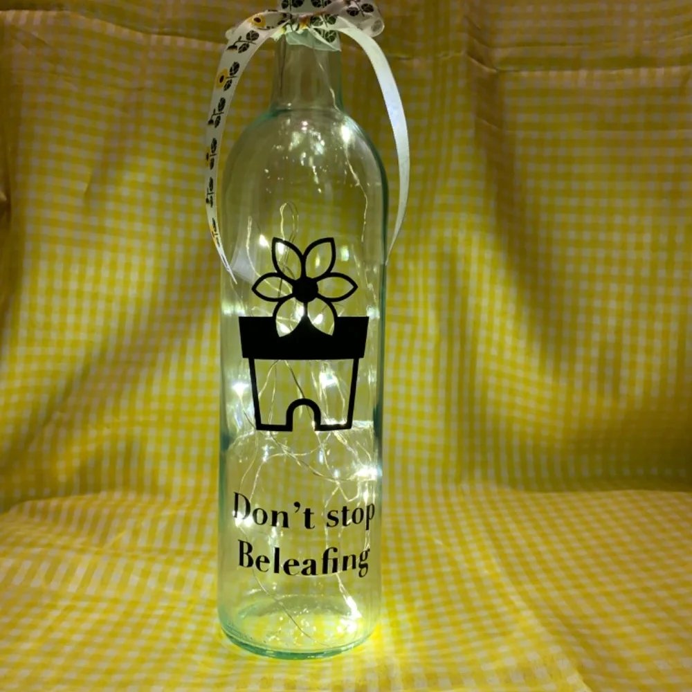 ‘Don’t Stop Beleafing’ logo wine bottle lantern